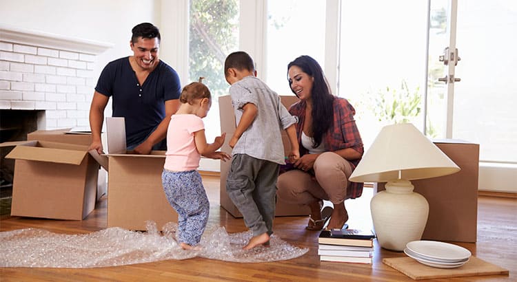 a family of first-time homeowners enjoying their first home