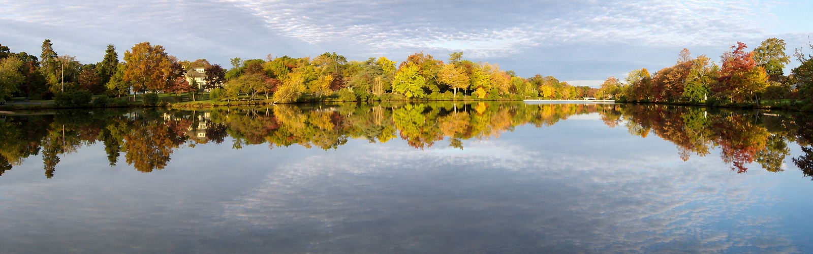 Fall foliage reflected across Cascade Lakes in Brightwaters, New York